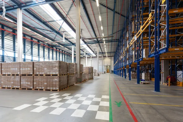 Spacious loading areas and clear aisles characterize this FTZ Warehouse, where goods are ready for global distribution.